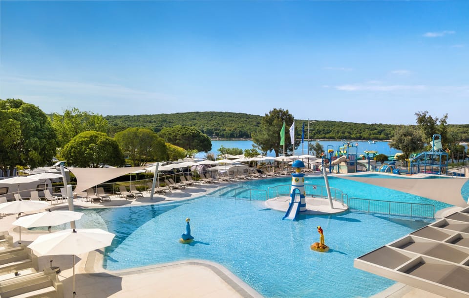 2 outdoor pools, open 9 AM to 7 PM, pool umbrellas, sun loungers
