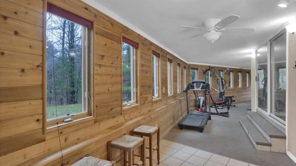 Spacious Sunroom with Floor-to-Ceiling Windows (Treadmill currently not working)