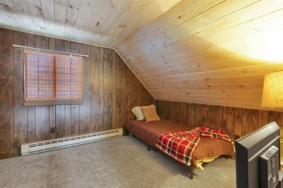 Cozy Loft Sleeping Area with Rustic Decor