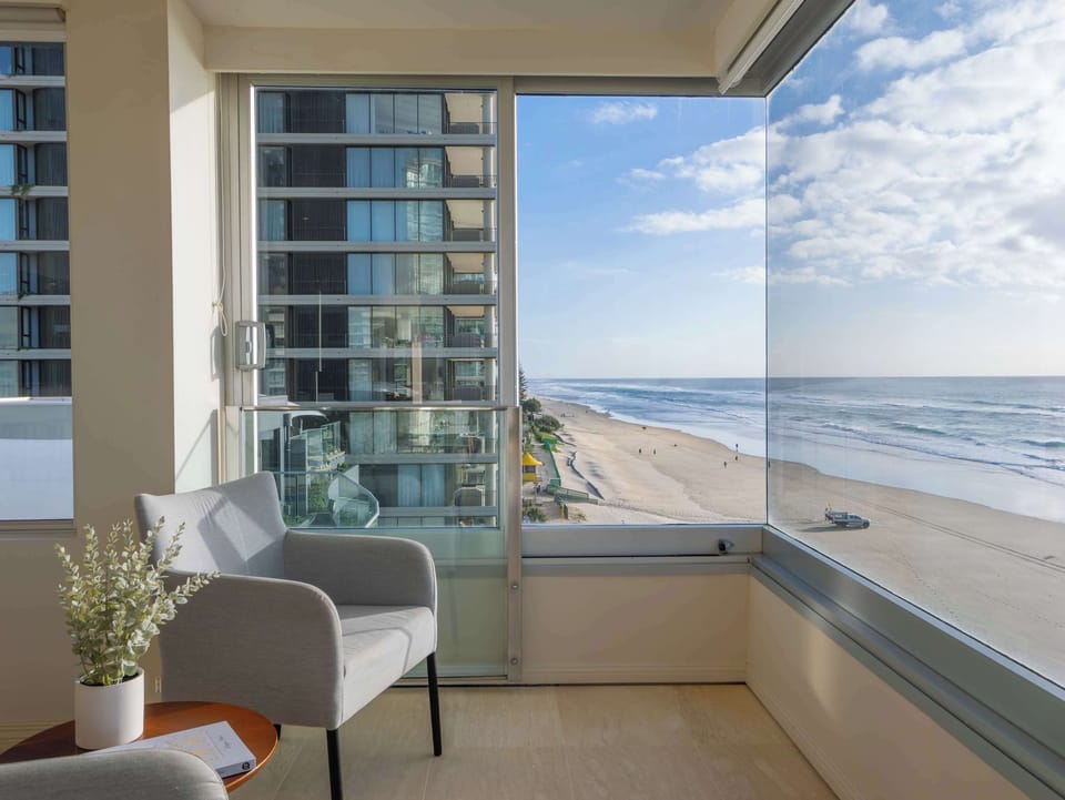 The corner outlook, the beach directly below the glass.