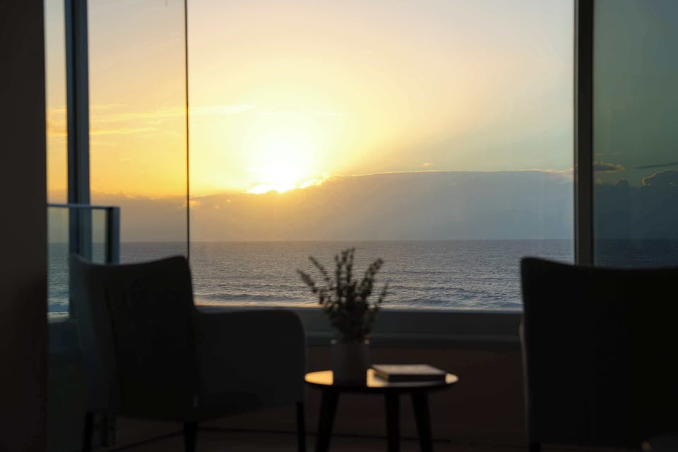 Sunrise over the water, straight ahead from the living room.