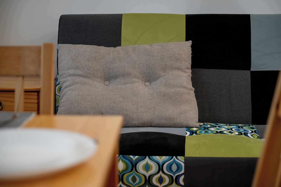 Close-up of the comfortable sofa with decorative cushions.