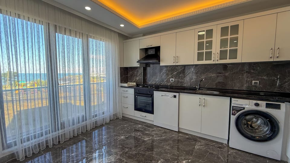 Apartment, Sea View | Private kitchen | Full-size fridge, microwave, oven, stovetop