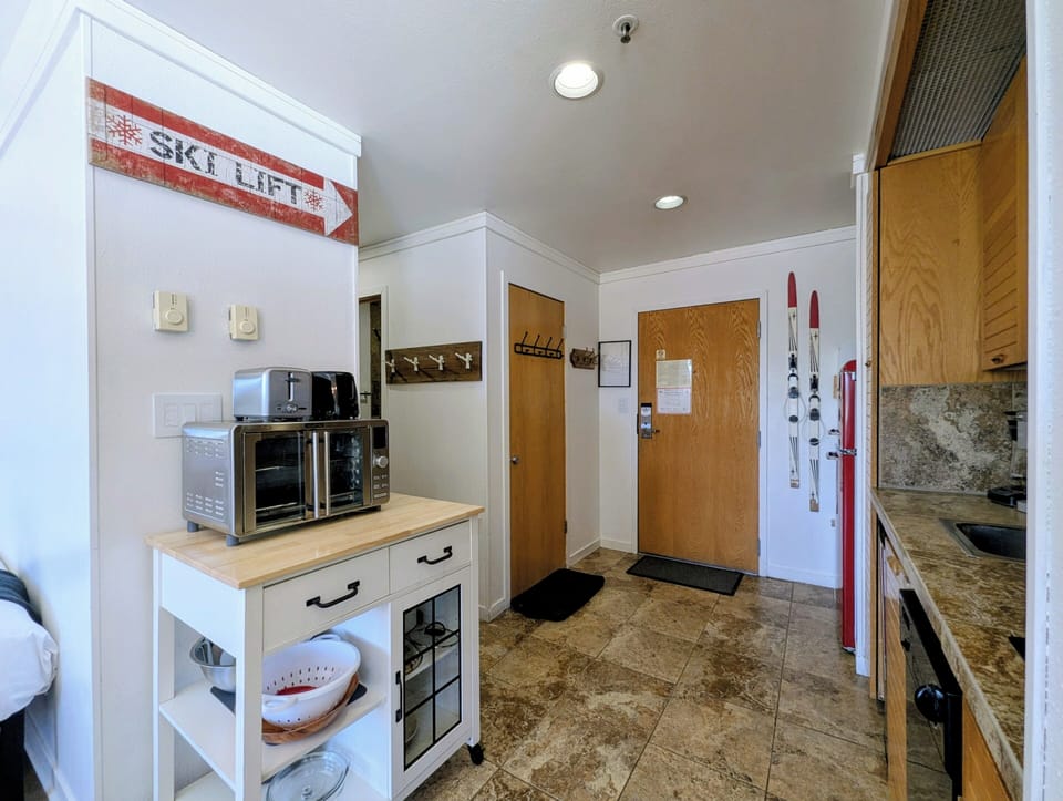 Step into your ski-in retreat where everything's ready: coffee maker and toaster on standby, skis propped by the door—just grab your gear and hit the slopes.