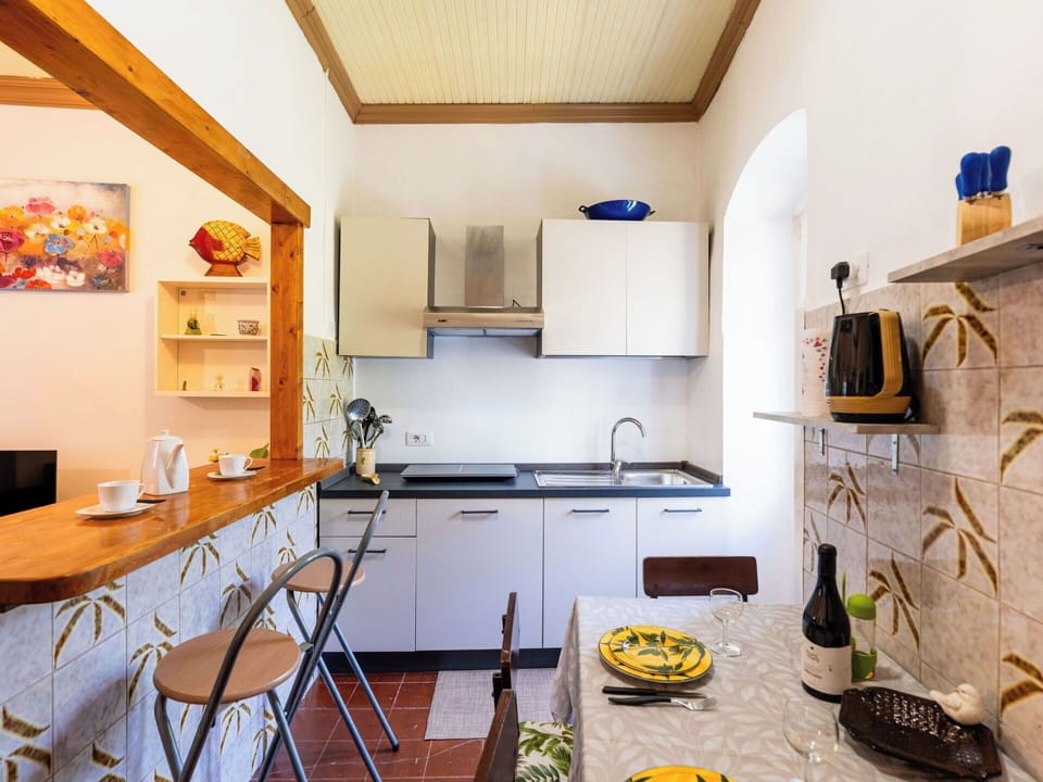 Furniture, Interior Design, Flooring, Wood, Kitchen, Countertop, Floor, Ceiling, Room, Lighting