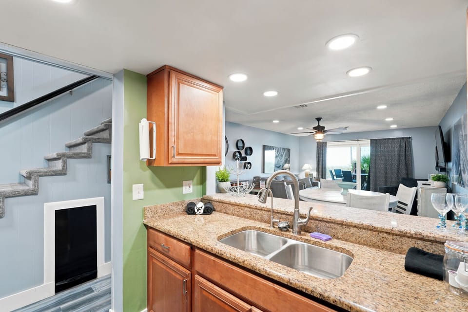 From your bright kitchen, take in the open floor plan that flows seamlessly into the living and dining areas—perfect for gathering and relaxing after a day of adventure.