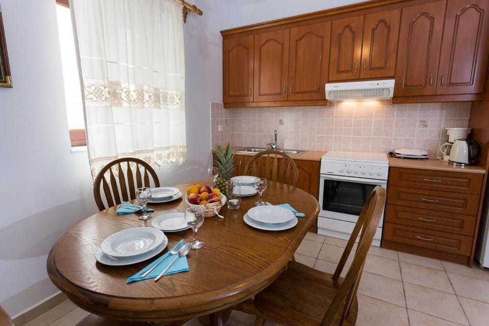 Fully equipped kitchen and dining area for preparing and enjoying meals together.