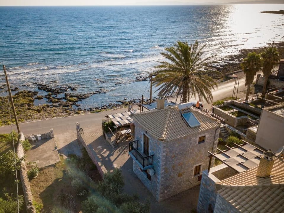 Unique aerial view of the accommodation beside the stunning coastline.