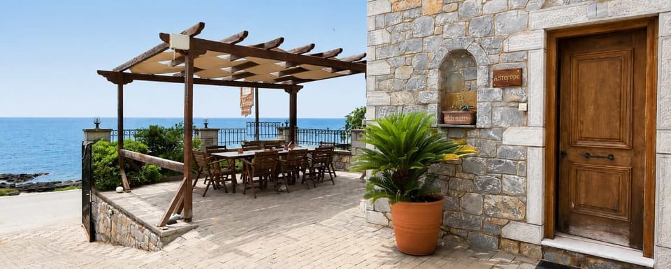Traditional stone exterior with a shaded private terrace.