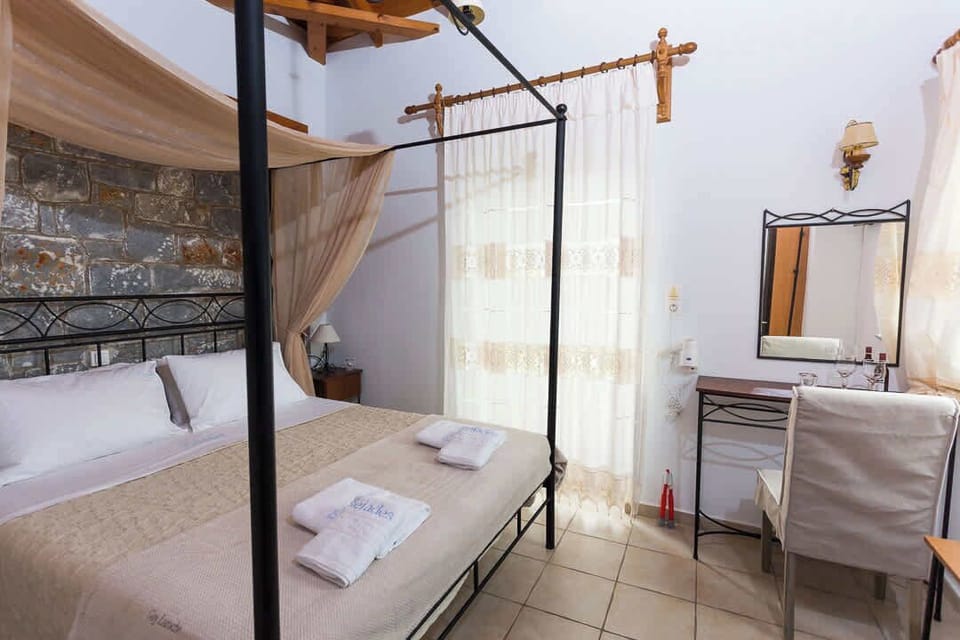 Peaceful bedroom with natural light and easy access to the terrace.