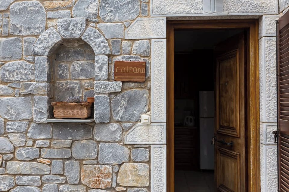Traditional stone entrance reflecting the authentic character of the property.