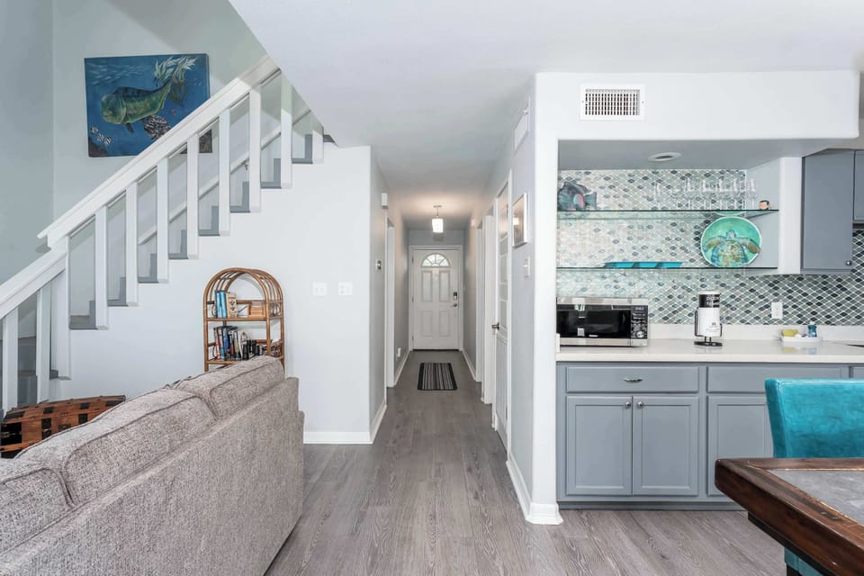 Open Living & Dining Space — A seamless flow between the lounge, dining, and kitchen areas—perfect for gathering and entertaining.
