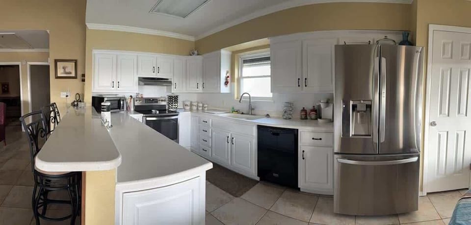 Kitchen counter with seating, perfect for casual dining, meal prep, and shared moments while cooking together