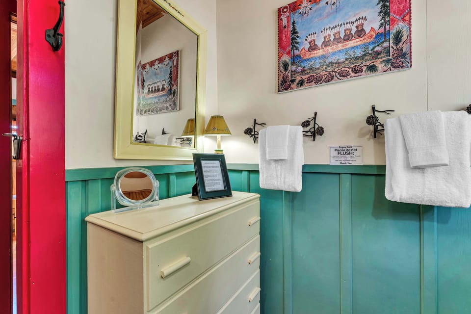 Bathroom 2: Shared full bathroom with a shower and hair dryer