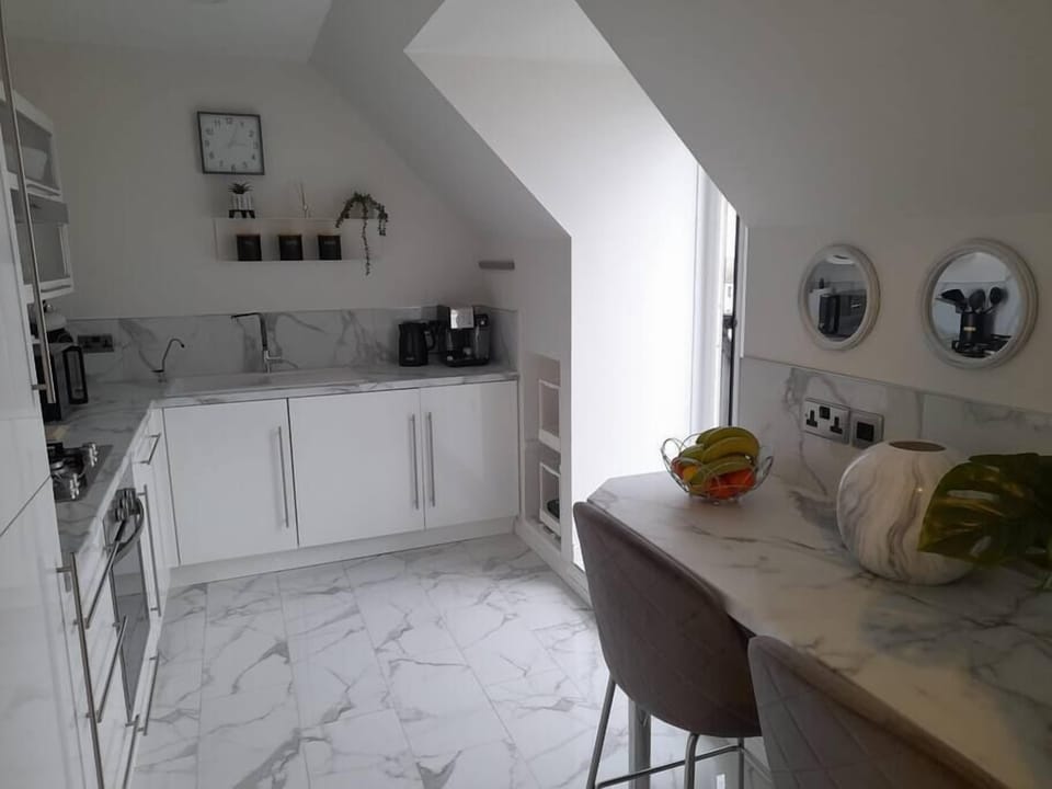 Breakfast bar with sockets for lap top connection. Work space  with sea views and good coffee.