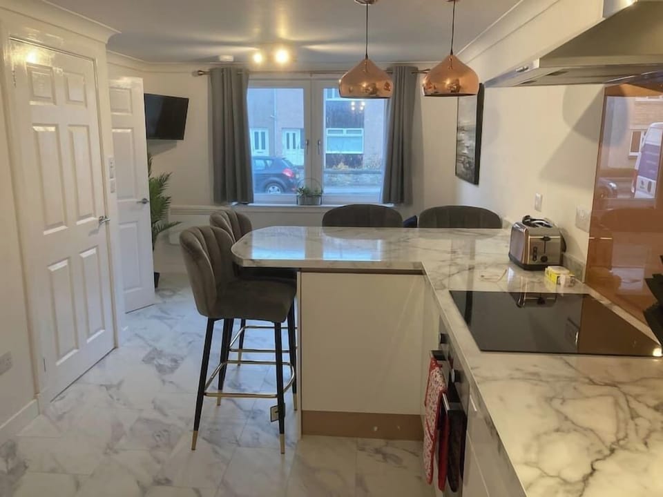 Open plan kitchen and dining area. Doubles as a work station for working from home.