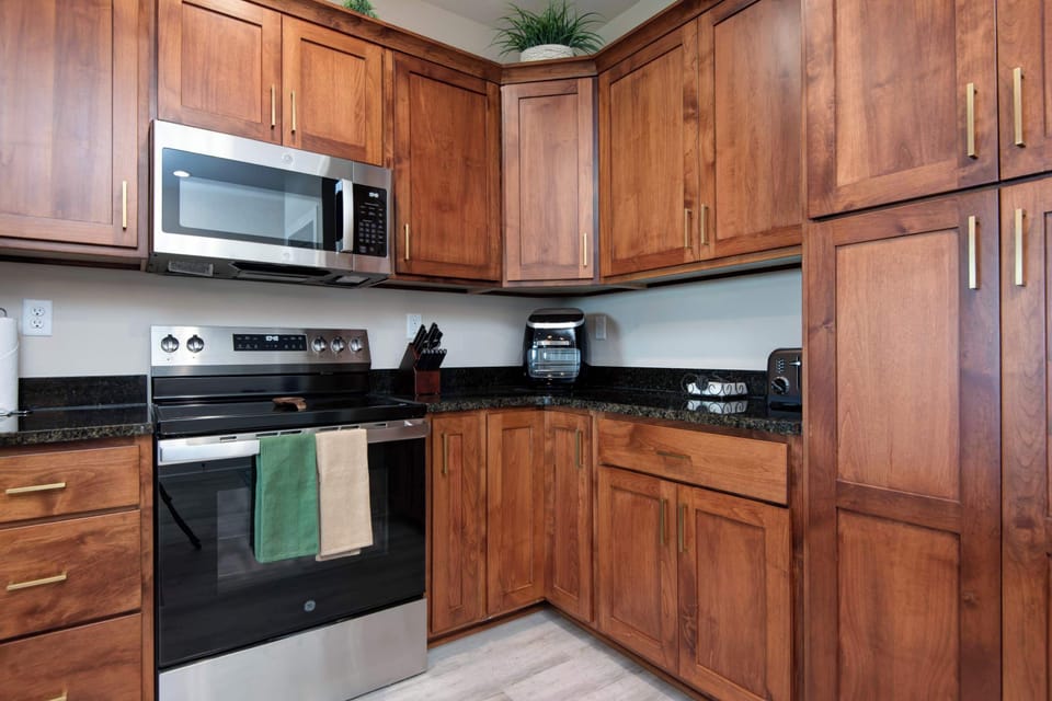 Generous kitchen space complete with premium stainless steel appliances.