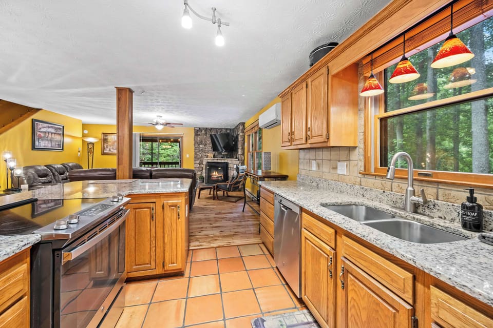 Open-concept chef's kitchen with breakfast bar seating