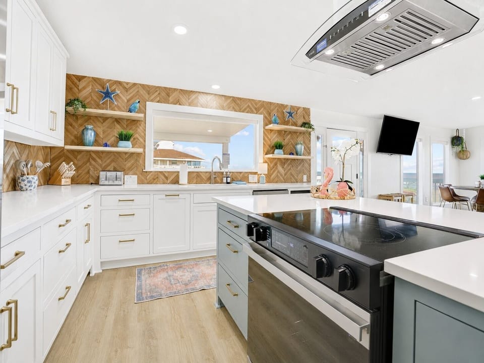 Kitchen: Bright and airy culinary haven with modern amenities and ocean views!