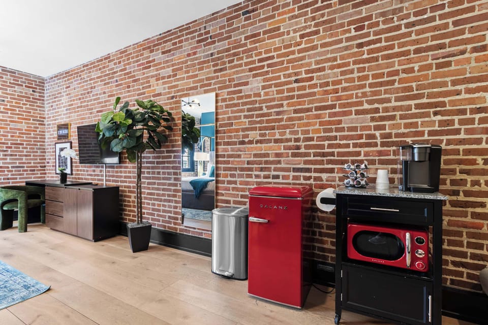 Enjoy added convenience with a Keurig coffee maker, complimentary K-Cups, sugar, creamers, a microwave, and mini refrigerator—perfect for a quick breakfast or late-night snack.