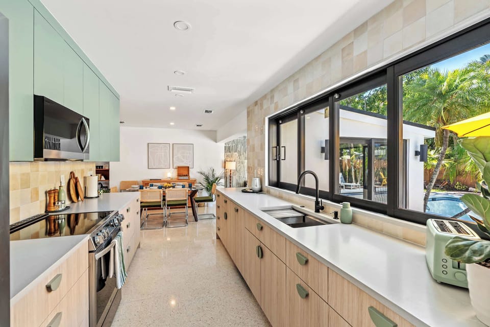 Galley kitchen opening through to the dining area and living room.