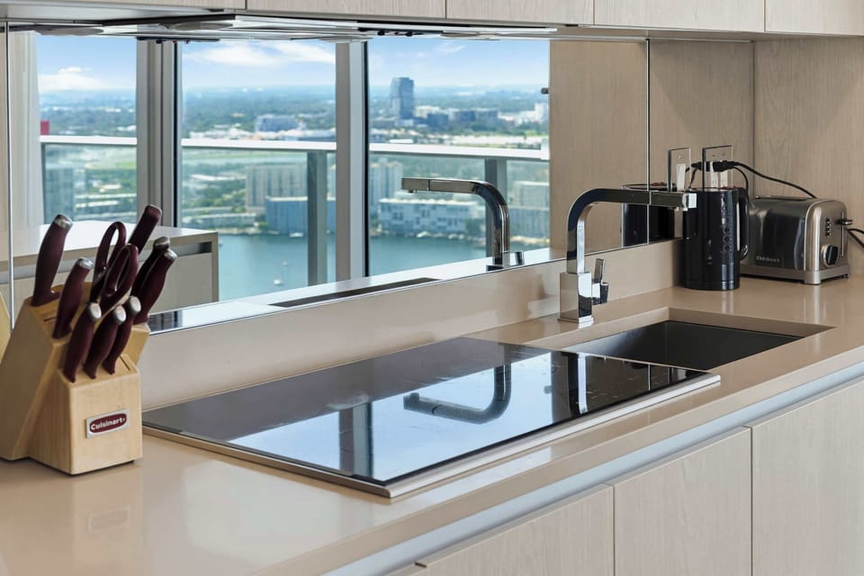 Sleek countertops and a well-stocked kitchen make cooking a breeze