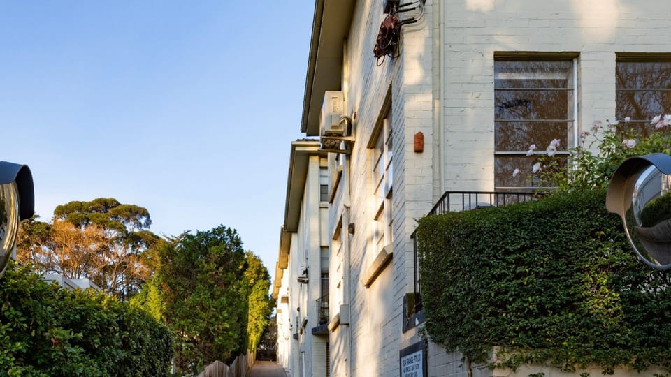 The well-maintained apartment building combines classic character with modern convenience.
