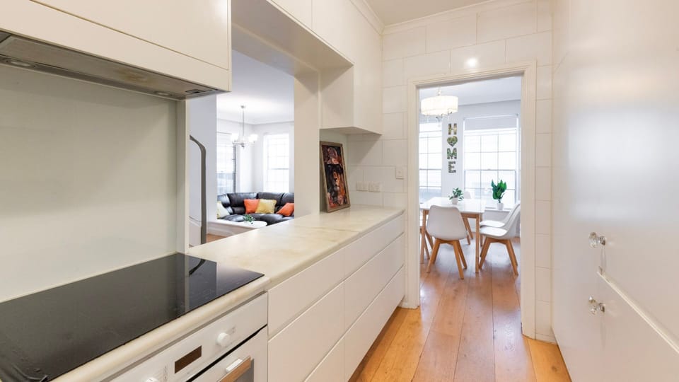 Clean lines and clever storage make the kitchen both practical and stylish.