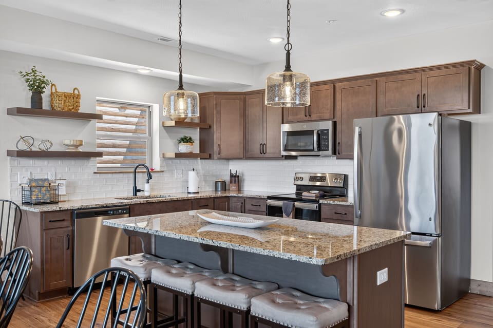 Beautiful kitchen with stainless steel appliances that is exceptionally well stocked for all your cooking needs.