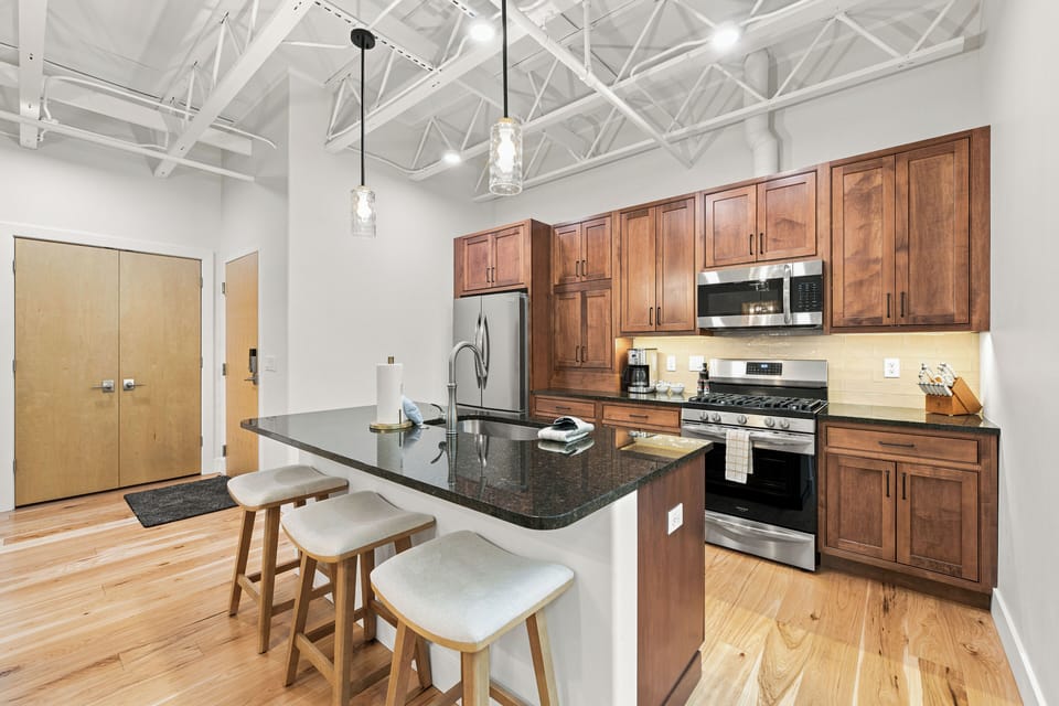 Modern kitchen with island seating and sleek open-concept style.