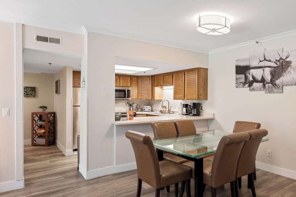 Enjoy meals together in the bright dining area with seating for four, seamlessly connected to the open kitchen for effortless entertaining and conversation.