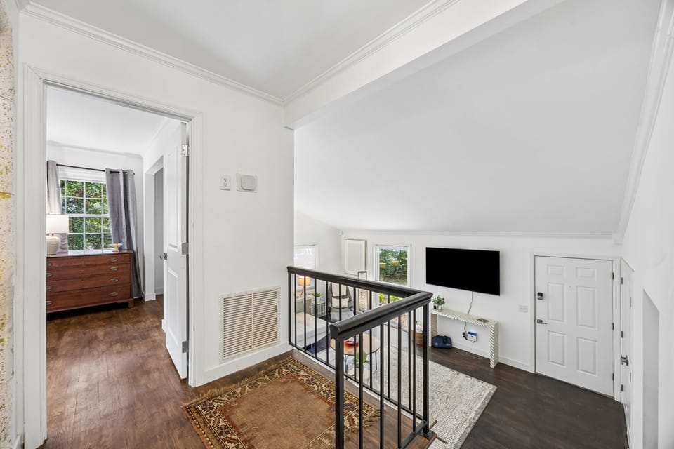 Looking down from the guest bedroom level to the living room