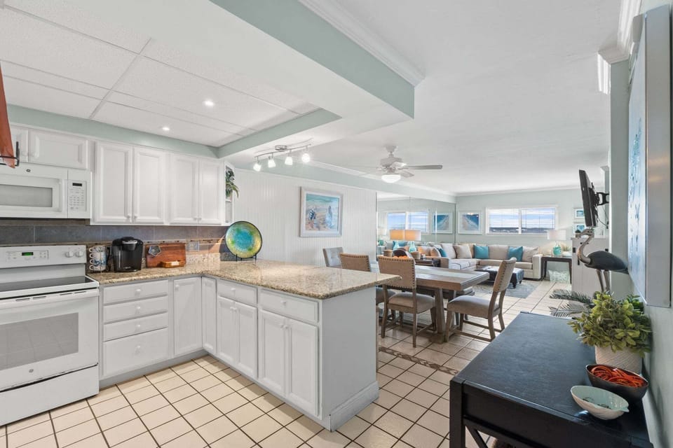The kitchen, dining area and living room are designed for easy flow and comfortable gathering.