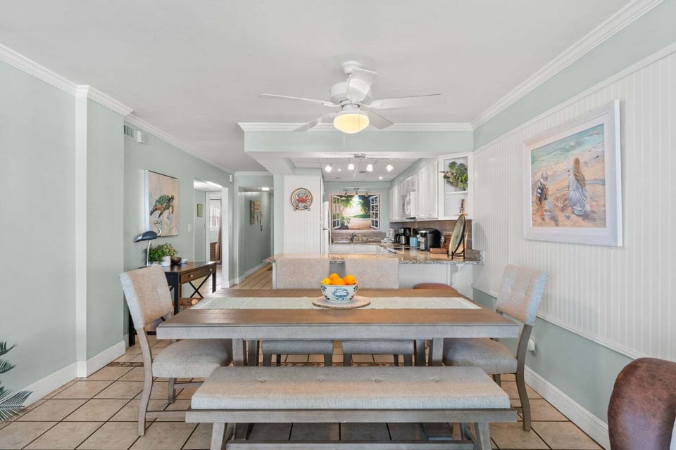 The open layout keeps the kitchen connected to both the dining area and living room.