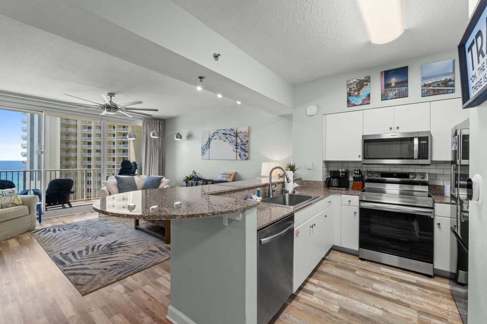 With plenty of counter space, it's easy to prep meals and enjoy time together in this bright, functional kitchen.
