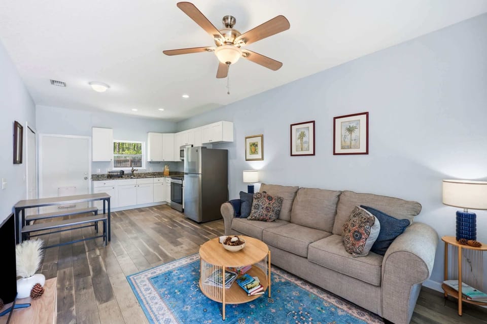 A bright, comfortable gathering space with a Smart TV and sofa sleeper