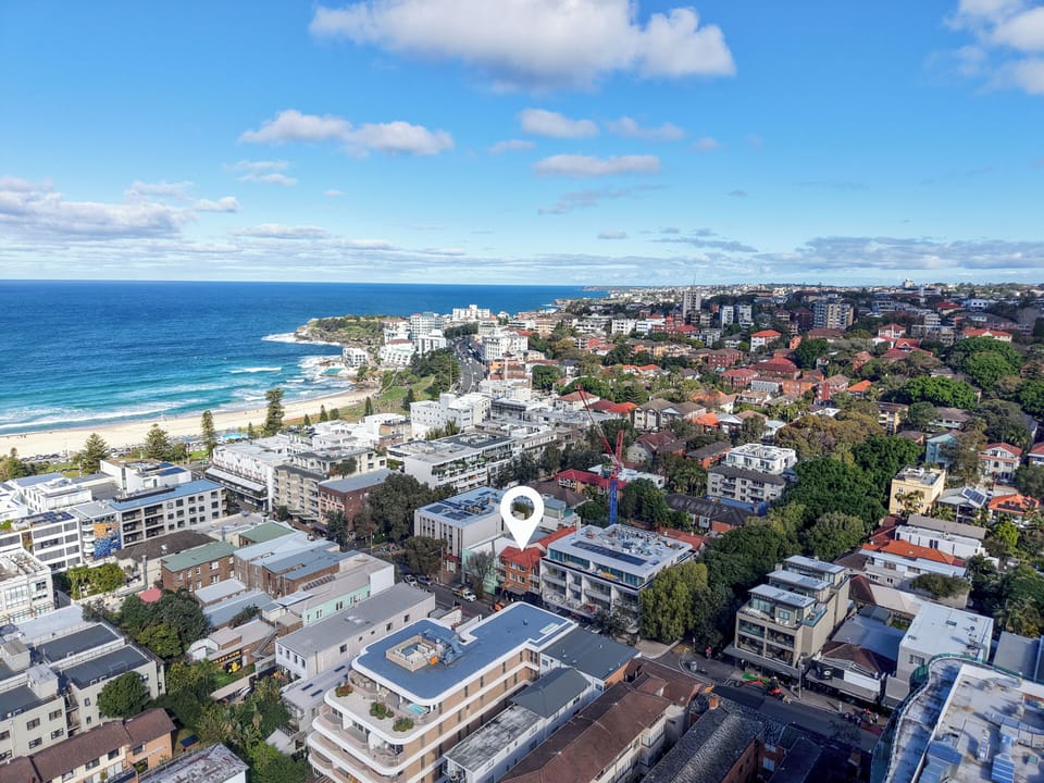 Aerial view marking property location near beach
