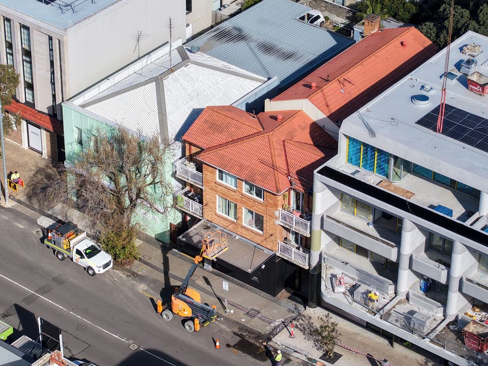 Aerial view of building exterior and street