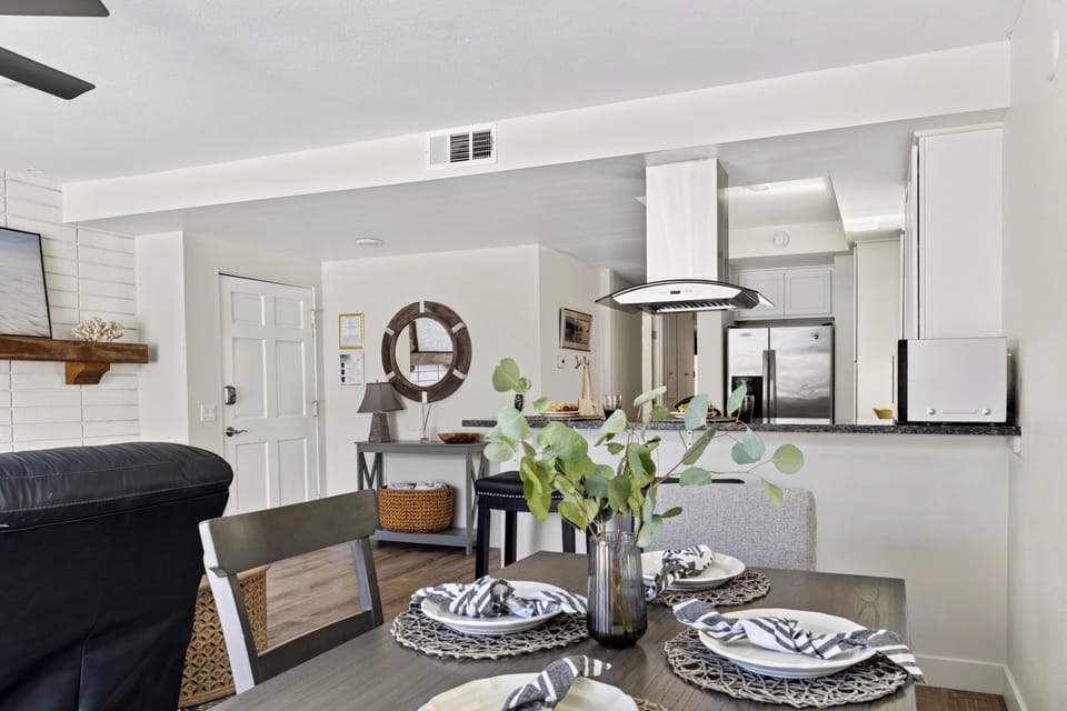 Bright dining nook styled for gatherings near the kitchen.
