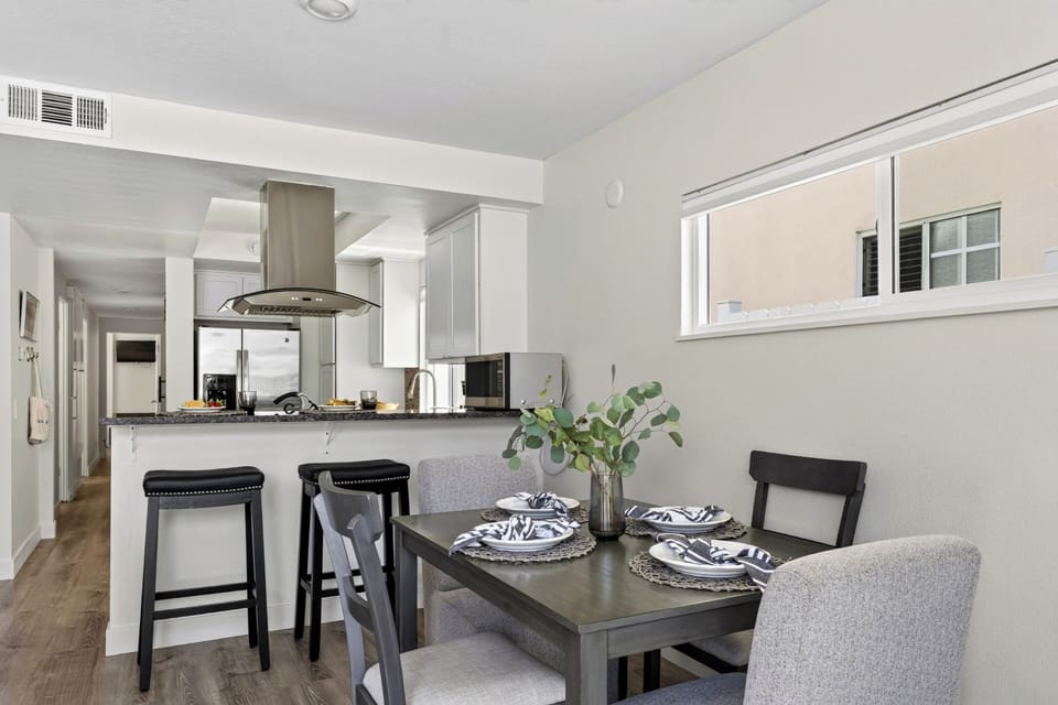 Open dining space with breakfast bar seating.