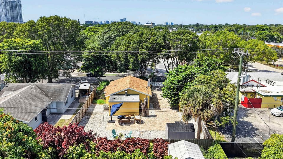 Elevated view of The Banana Cabana's fenced backyard patio and outdoor seating area, an inviting spot to relax after a day exploring West Palm Beach