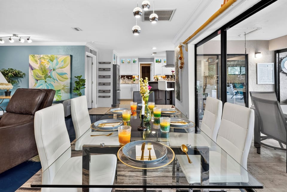 Dining area with tropical style, open kitchen views, and easy flow to the patio.