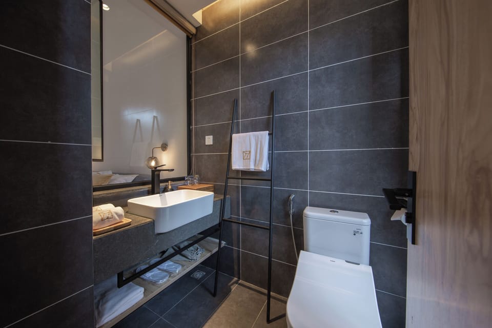 Signature Double Room | Bathroom | Shower, hair dryer, slippers, towels