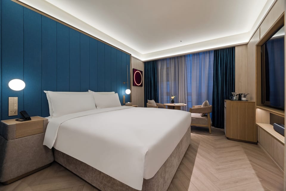 Business Double Room | Minibar (free items), blackout drapes, iron/ironing board (on request)