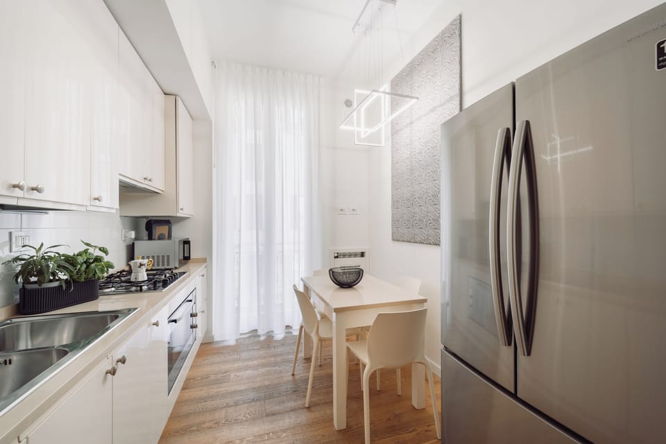Comfort Apartment | Private kitchen | Espresso maker, coffee/tea maker, electric kettle, highchair