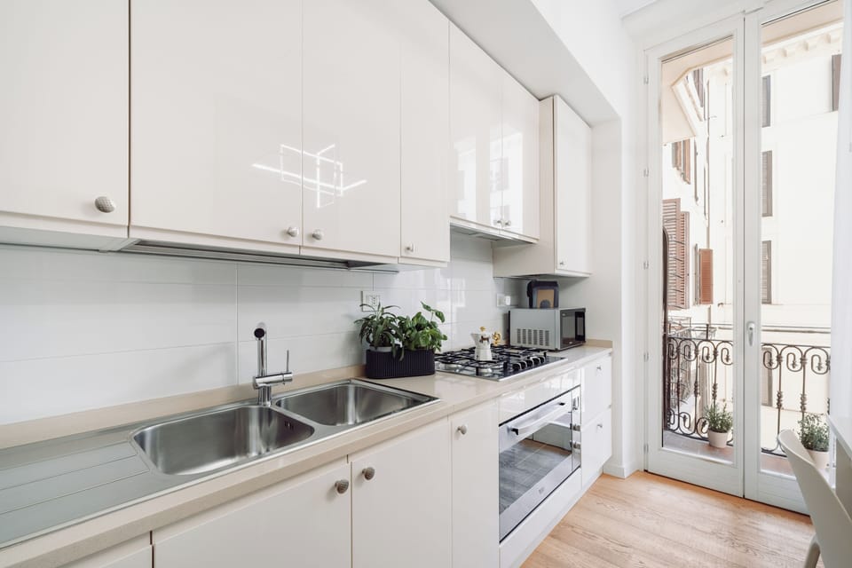 Comfort Apartment | Private kitchen | Espresso maker, coffee/tea maker, electric kettle, highchair