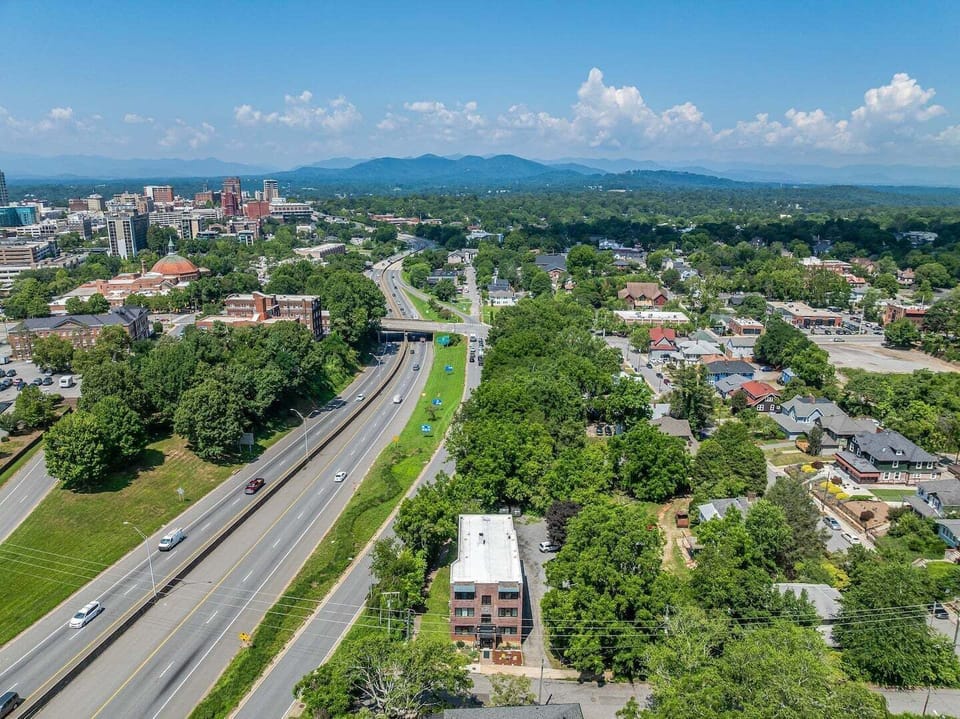 Aerial view showing the property's convenient location near downtown Asheville and major roadways.