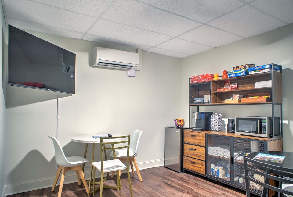 Shared Community Lounge with Seating, Tables, a Smart TV, Board games, and a Refreshment Station.