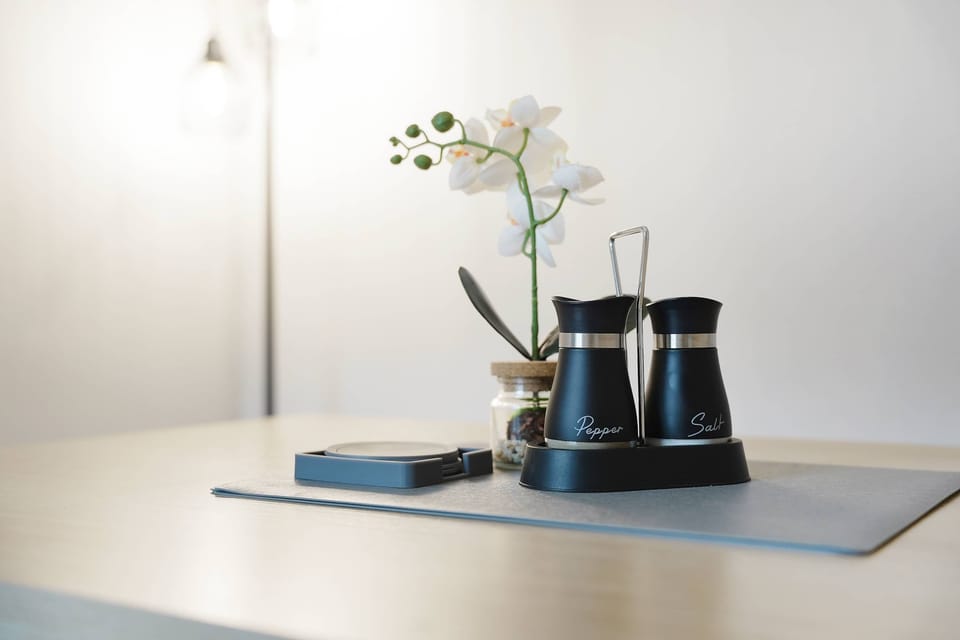 Designed for both dining and productivity, this dedicated area features a table and seating for four. Enjoy home-cooked meals, use the space as a temporary workstation, or relax with family and friends in a comfortable setting.