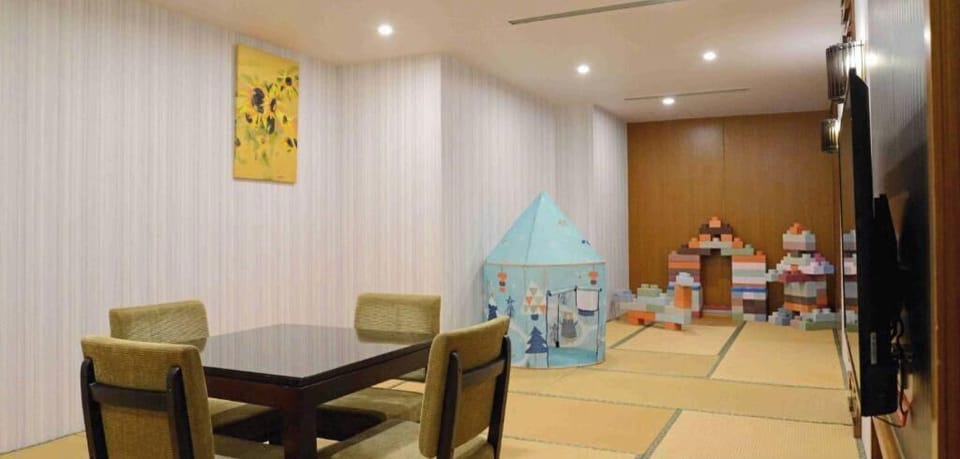 Deluxe Quadruple Room, Balcony, Garden View | Children's area